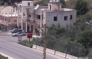 land with shops and apartments for sale in batroun